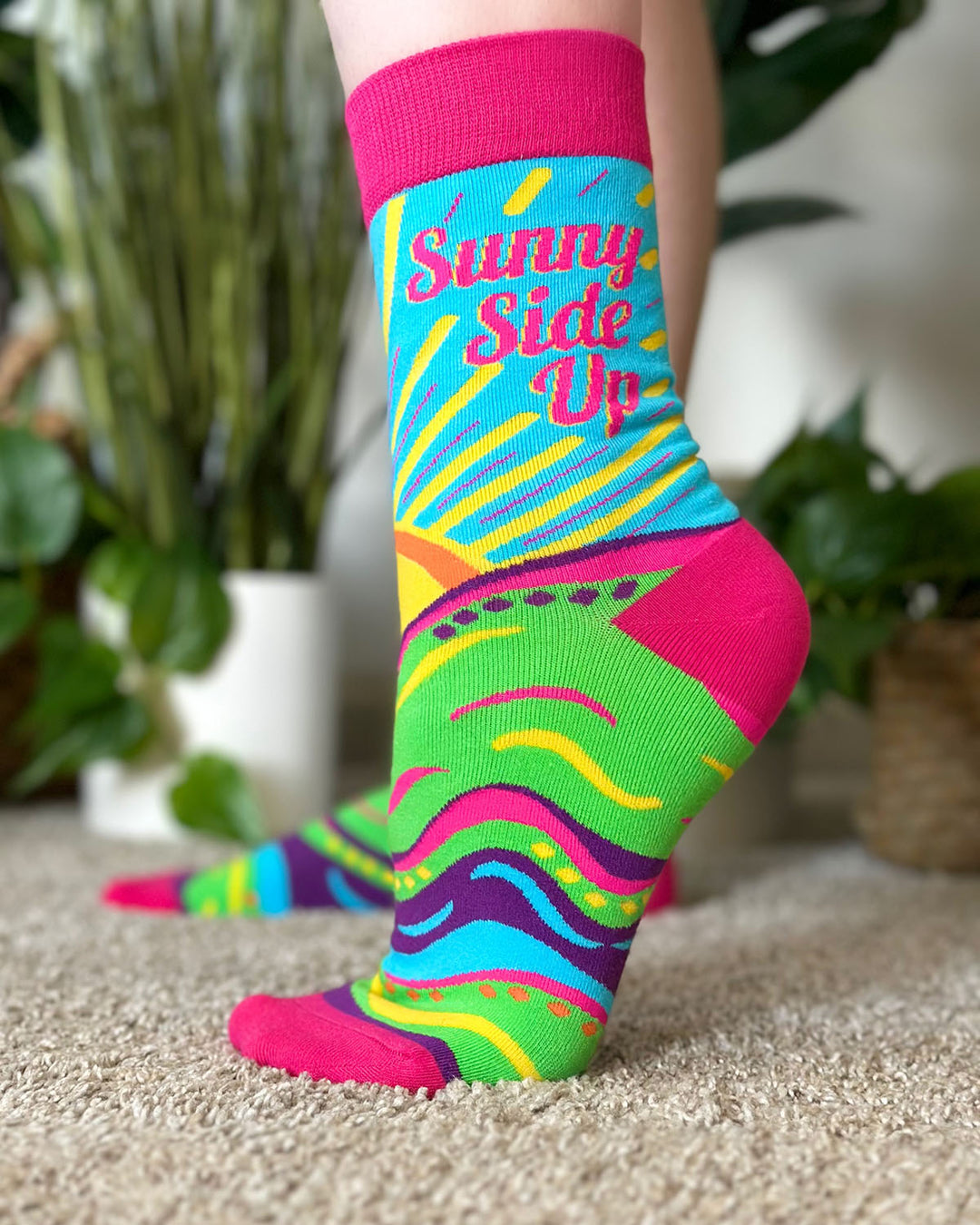 Features beautiful sun, a clear blue sky, and the saying "Sunny Side Up" Ladies' Novelty Crew Socks.
